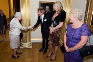 Queen Elizabeth speaks to Rod Stewart and Penny Lancaster during a reception and awards ceremony at Royal Academy of Arts in London, Britain October 11, 2016. Picture taken October 11, 2016. REUTERS/Jeff Spicer/Pool